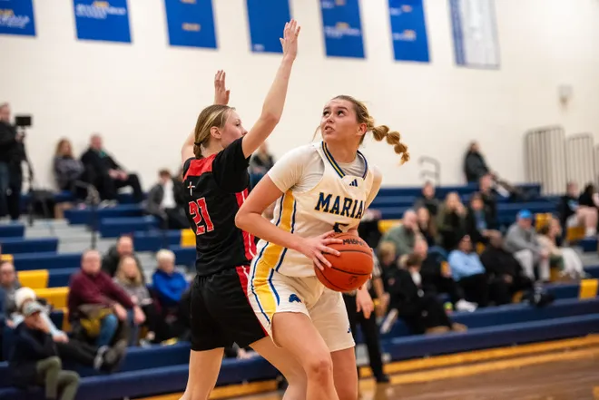 Mckenzie Swanson attacks the basket during a Catholic League girls basketball games on Wednesday, Jan. 17, 2024 (courtesy Brandon Folsom/Hometown Life)
